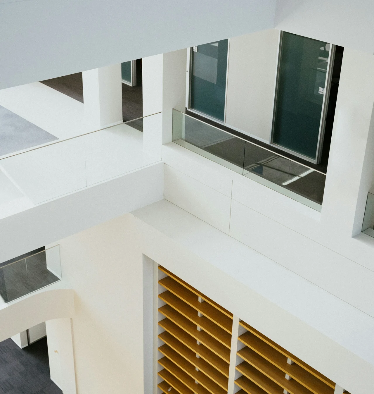 Sunlight and clean lines in a contemporary white architectural courtyard
